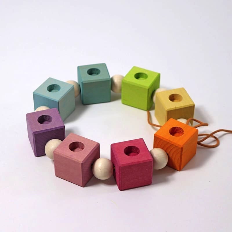 Anillo de cumpleaños cubos tonos pastel de Grimm's en Libélula Azul