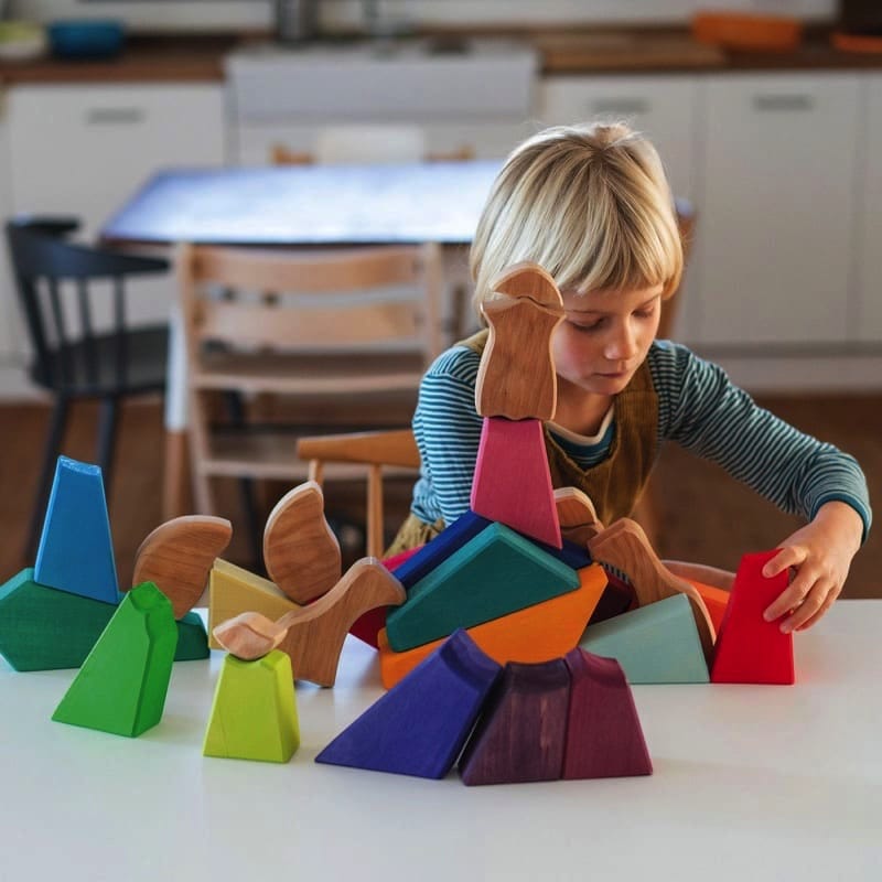 Bloques y puzzle león arcoiris de Grimm's en Libélula Azul