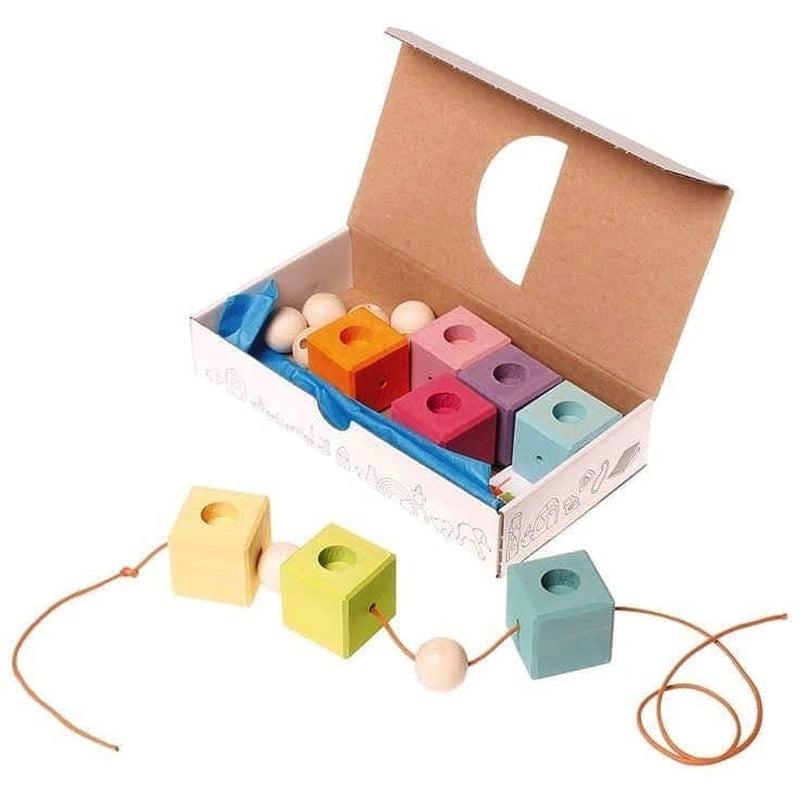 Anillo de cumpleaños cubos tonos pastel de Grimm&#39;s en Libélula Azul